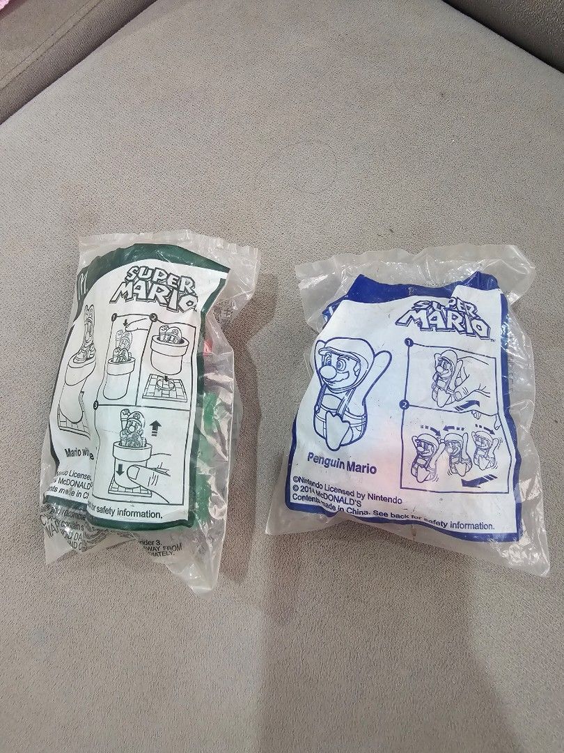 Super Mario Happy Meal Toys (Category: Character Goods) located in Manaoag. Submitted by dressupdear (Listing ID 1456799952, Image 1). Description: 60 PESOS EACH or BUY BOTH FOR 100 PESOS. Sealed includes - Mario with Pipe - Penguin Mario.