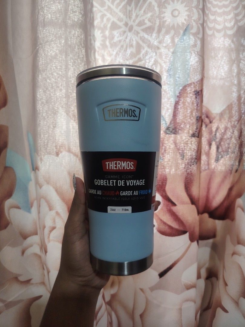 Thermos (Category: Water Bottles & Tumblers) located in Mandaluyong City. Submitted by twovv (Listing ID 1456854356, Image 3). Description: The Thermos ICON™ Mug with Slide Lock Lid 24oz in Glacier blue features double-wall vacuum insulation and a capacity of 710ml. It uses durable 18/8 stainless steel and a sweat-proof exterior. The slide-lock lid design helps prevent spills during commutes. It keeps beverages hot or cold for extended hours usin
