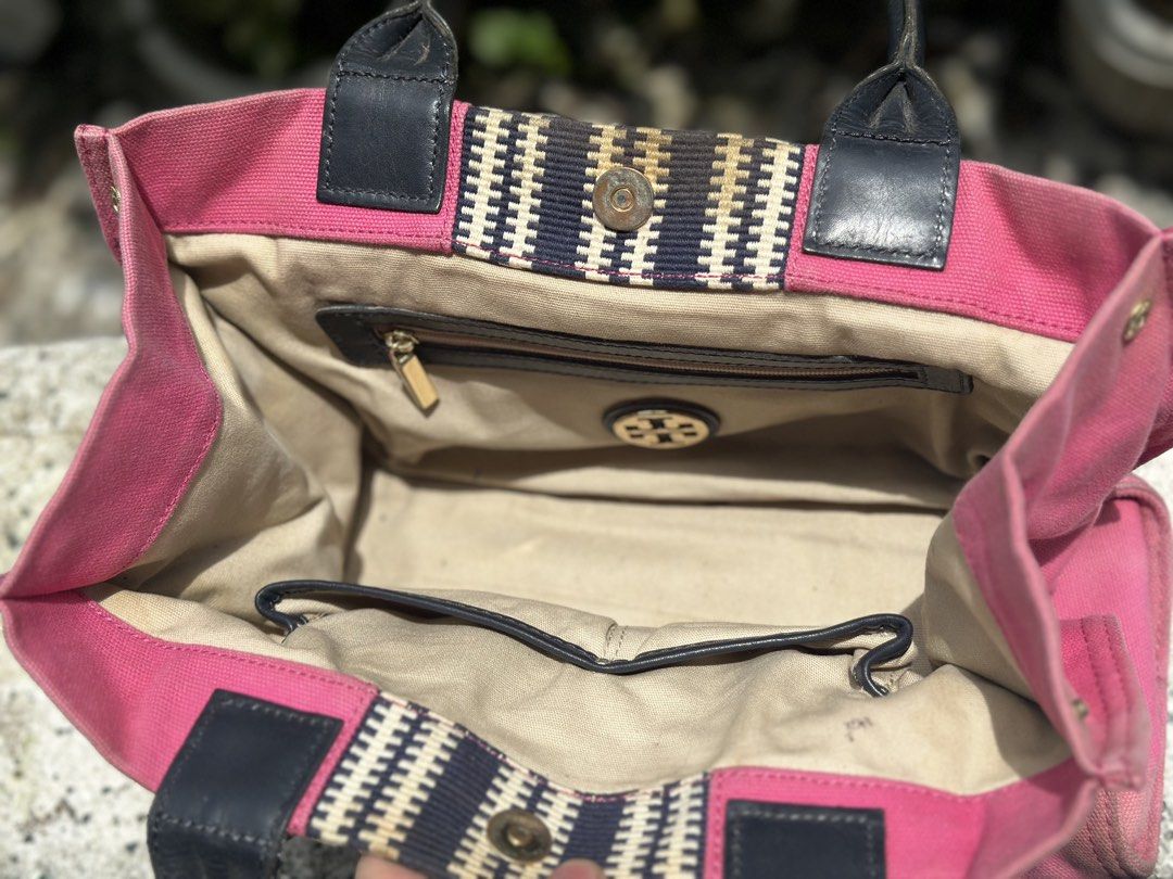 Tory Burch Pink Canvas Tote Bag (Category: Luxury Bags & Wallets) located in Pasig City. Submitted by lancer501 (Listing ID 1456814623, Image 2). Description: - Tory Burch pink canvas tote bag - Genuine leather handles and trim - Interior zippered pocket and slip pocket - Decorative woven stripe detail on the front - Ideal for everyday errands or travel adventures -shipping shouldered by buyer.