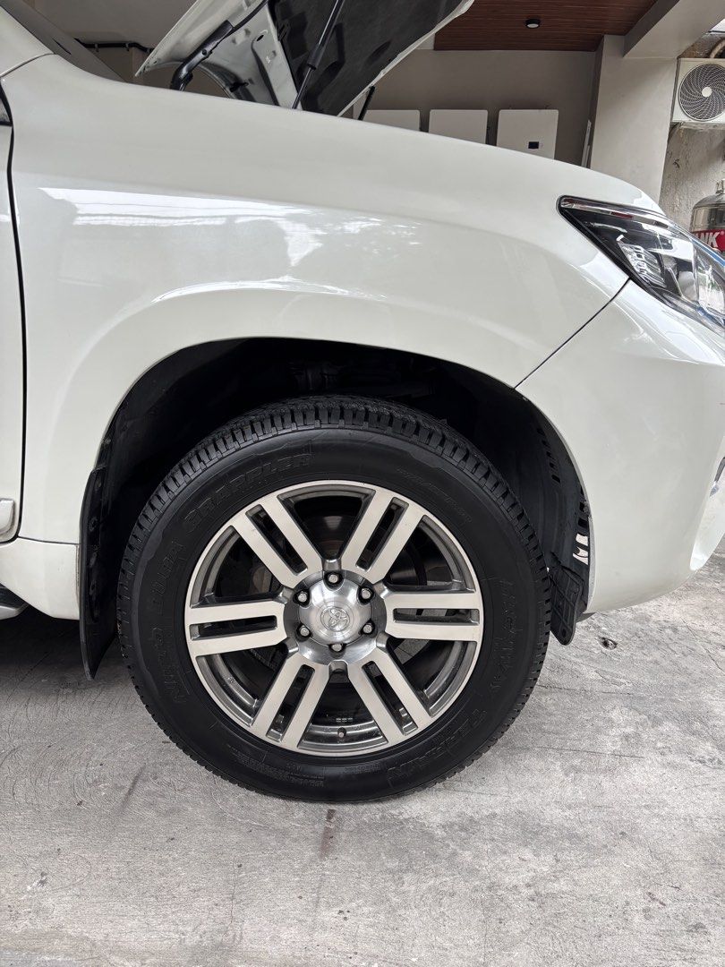 Toyota Land Cruiser 4.0 Prado V6 (A) (Category: Used Cars) located in Pasig City. Submitted by _junmm1_ (Listing ID 1456843544, Image 3). Description: 2012 prado face lifted to 2018 Good condition Ready for long drive 20 in mags Nitto HT tires 95% thread Tow hook Projector fog lamp Slightly negotiable Cold Aircon Local unit Well maintained .