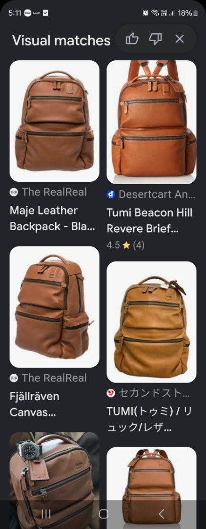 Tumi Leather and Canvas Backpack (Category: Luxury Bags & Wallets) located in Valenzuela. Submitted by _myperfectstuff (Listing ID 1456863514, Image 3). Description: - Durable brown leather and dark grey canvas construction - Multiple zippered compartments on the front for easy access - Padded shoulder straps for maximum comfort during wear - Convenient side pockets for water bottles or small essentials - Ideal for daily commutes, school, or trav