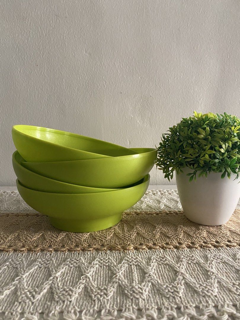 Tupperware Lime Green Bowls Set of 4 (Category: Dinnerware & Cutlery) located in Cavite. Submitted by yc.shoppemnl (Listing ID 1456858352, Image 3). Description: - Set of 4 Tupperware bowls - Bright lime green color - Ideal for serving snacks, cereal, or soup - Stackable for convenient storage - Made from durable plastic - Perfect for everyday use.