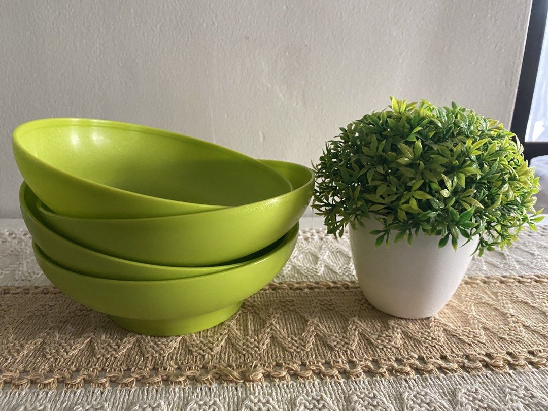 Tupperware Lime Green Bowls Set of 4 (Category: Dinnerware & Cutlery) located in Cavite. Submitted by yc.shoppemnl (Listing ID 1456858352, Image 2). Description: - Set of 4 Tupperware bowls - Bright lime green color - Ideal for serving snacks, cereal, or soup - Stackable for convenient storage - Made from durable plastic - Perfect for everyday use.