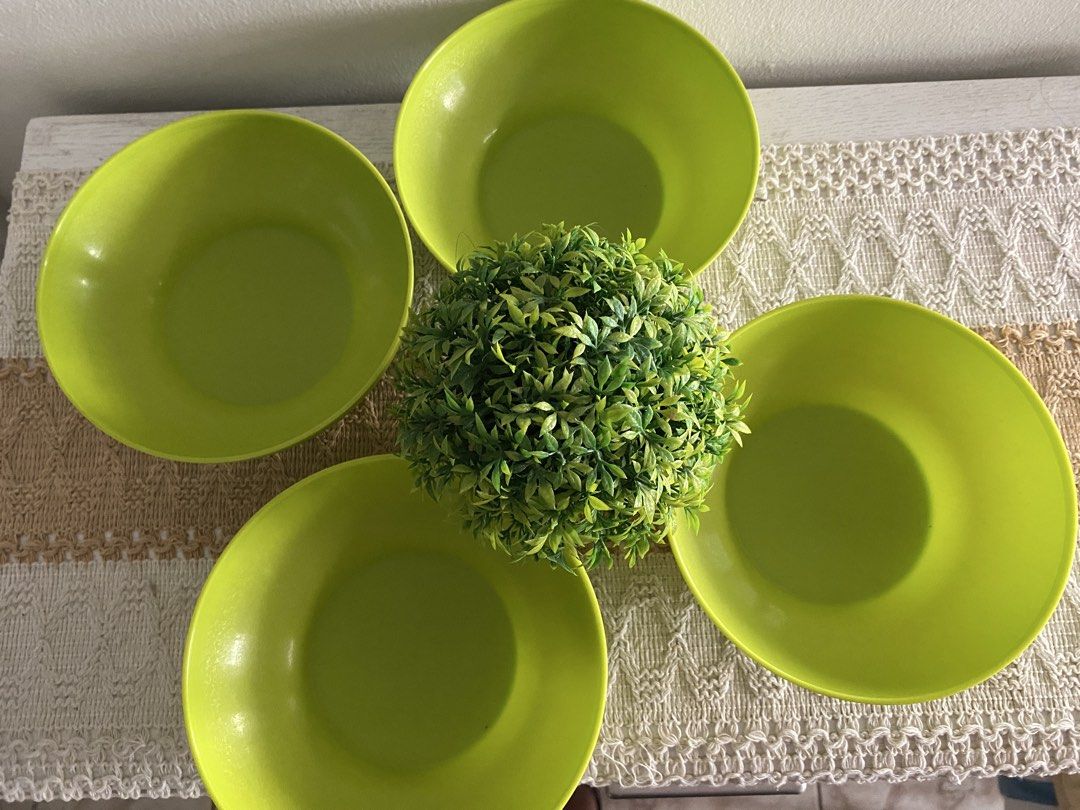 Tupperware Lime Green Bowls Set of 4 (Category: Dinnerware & Cutlery) located in Cavite. Submitted by yc.shoppemnl (Listing ID 1456858352, Image 1). Description: - Set of 4 Tupperware bowls - Bright lime green color - Ideal for serving snacks, cereal, or soup - Stackable for convenient storage - Made from durable plastic - Perfect for everyday use.