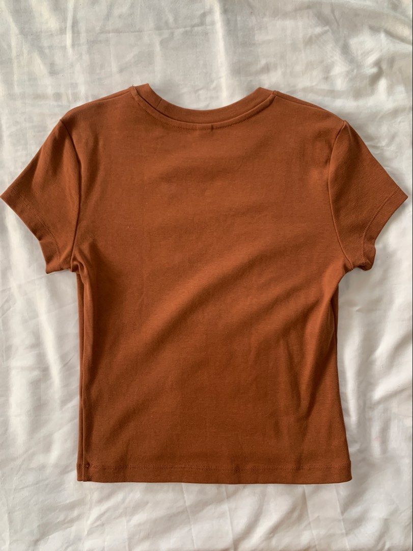 Uniqlo mini shirt brown baby tee (Category: Shirts) located in Quezon City. Submitted by jsjaemdeclutter (Listing ID 1456874120, Image 2). Description: .