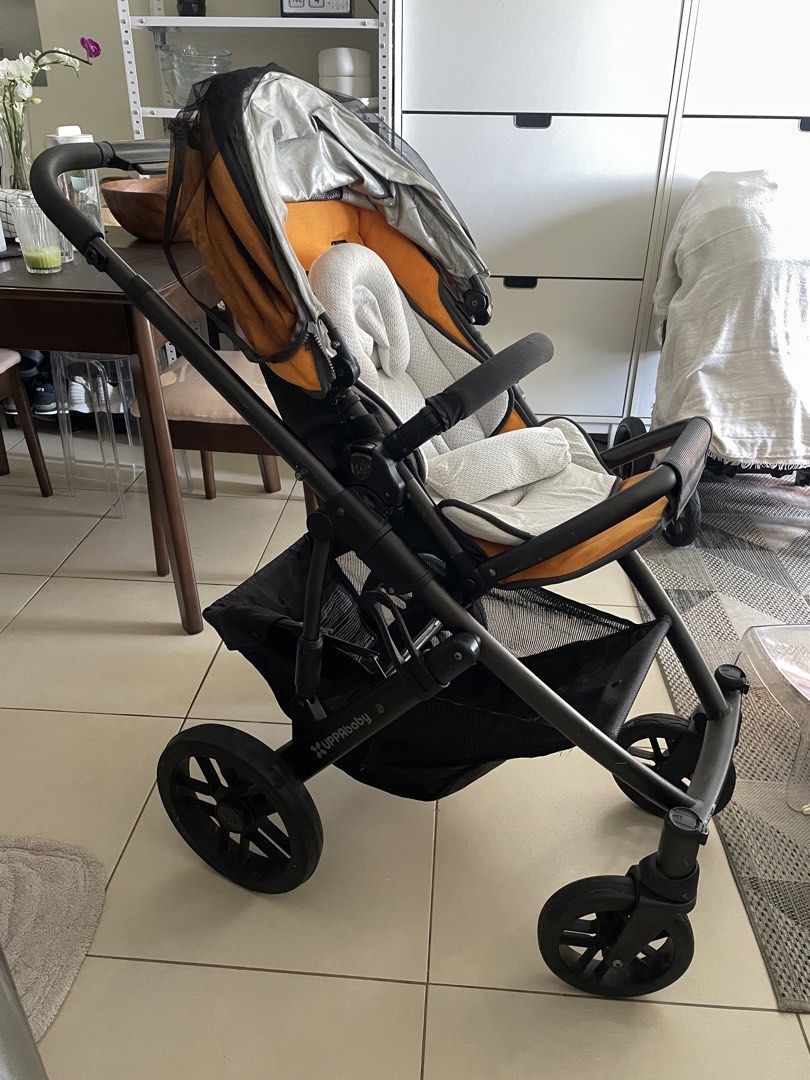 UPPAbaby Stroller with Bassinet - Orange (Category: Strollers) located in Taguig. Submitted by forwarriorgabgab (Listing ID 1451779309, Image 2). Description: - UPPAbaby stroller and bassinet set - Well-used condition but still very operational and usable - Issues: underseat storage zipper with minor tear; seat canopy connector damaged but still functional; signs of wear (i.e. scratches) - Color: Orange and black - Suitable for newborns and toddl