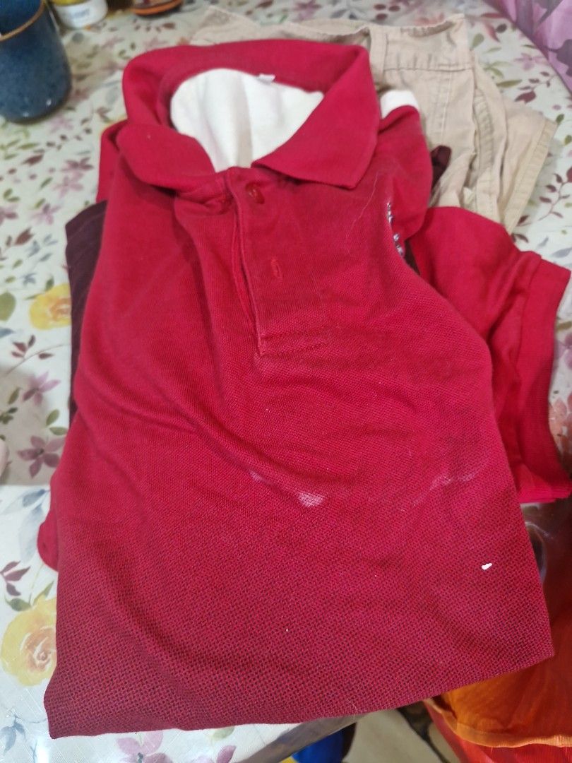 UST CICS (Category: Tshirts & Polo Shirts ) located in Manila. Submitted by inaydearest (Listing ID 1456823822, Image 1). Description: - Classic red polo shirt - Features a crisp white collar and placket - Two-button closure - Convenient left chest pocket - Note: Some light marks on the front - Perfect for casual outings.
