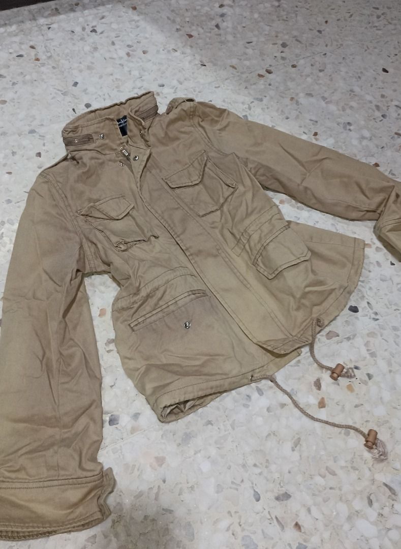 Utility Jacket (Category: Coats, Jackets and Outerwear) located in Puchong. Submitted by farr0s (Listing ID 1456930127, Image 1). Description: - Khaki utility jacket with multiple pockets - Zip and button closure - Drawstring waist for adjustable fit - Collar can be buttoned up - Ideal for layering/ hiking -Size: m -Top: 38" bust , length 21" -Condition: 8/10, no defect.