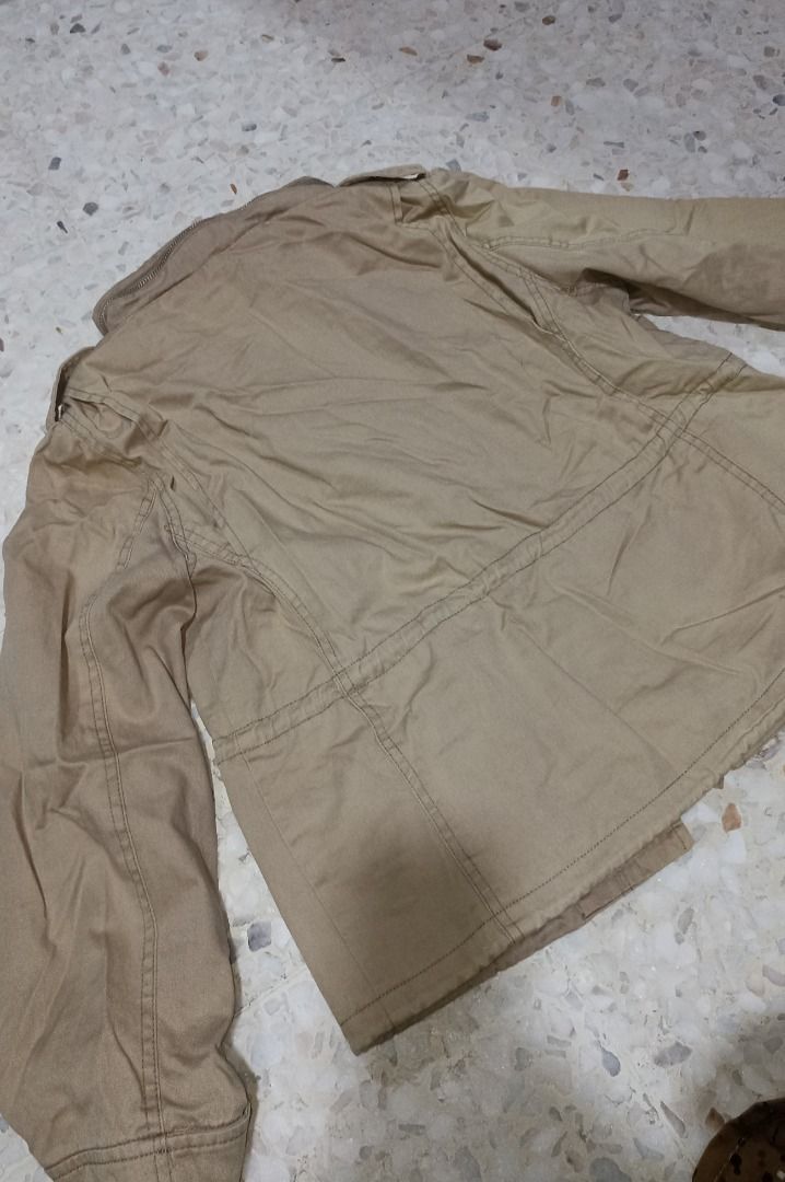 Utility Jacket (Category: Coats, Jackets and Outerwear) located in Puchong. Submitted by farr0s (Listing ID 1456930127, Image 3). Description: - Khaki utility jacket with multiple pockets - Zip and button closure - Drawstring waist for adjustable fit - Collar can be buttoned up - Ideal for layering/ hiking -Size: m -Top: 38" bust , length 21" -Condition: 8/10, no defect.