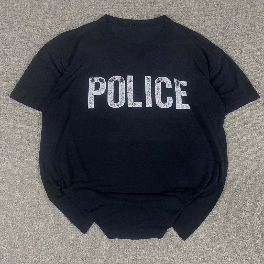 Vintage 90s Police Tshirt (Category: Tshirts & Polo Shirts ) located in Los Banos. Submitted by adothrift (Listing ID 1456947348, Image 3). Description: Vintage 90s Police Tshirt Size: L-XL Dimensions: Width - 25 Length - 29 .