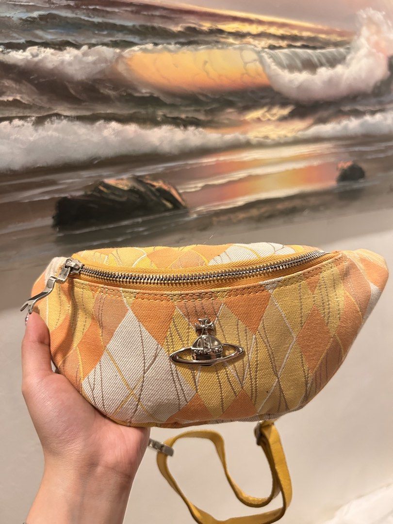 Vivienne westwood Argyle Belt Bag (Category: Luxury Bags & Wallets) located in Pasig City. Submitted by kawaiibags (Listing ID 1456832014, Image 1). Description: - Vivienne Westwood - Argyle Belt Bag - Yellow and white/cream tones. - Adjustable strap, zippered closure, compact size for essentials. - Can be worn as a belt bag or crossbody. Issue: need wash only.