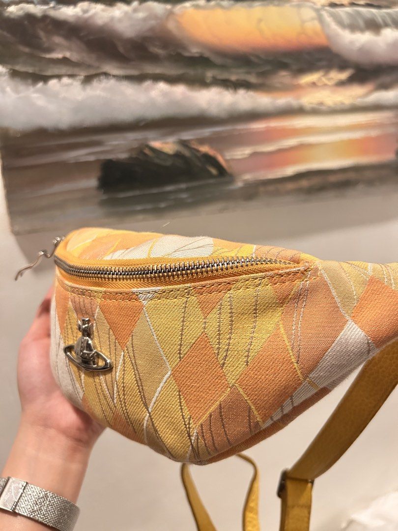 Vivienne westwood Argyle Belt Bag (Category: Luxury Bags & Wallets) located in Pasig City. Submitted by kawaiibags (Listing ID 1456832014, Image 2). Description: - Vivienne Westwood - Argyle Belt Bag - Yellow and white/cream tones. - Adjustable strap, zippered closure, compact size for essentials. - Can be worn as a belt bag or crossbody. Issue: need wash only.