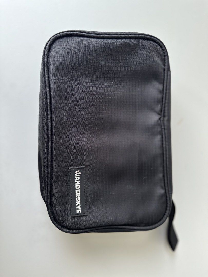 WANDERSKYE Hanging Toiletry Bag Organizer (Category: Luxury Bags & Wallets) located in Quezon City. Submitted by donsalta (Listing ID 1456884057, Image 1). Description: - Brand: WANDERSKYE - Color: Black - Has multiple compartments for organization - Has a convenient hanging hook - Ideal for travel - Folds up neatly for easy storage.