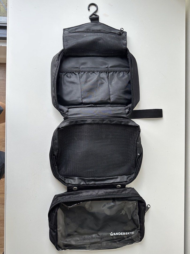 WANDERSKYE Hanging Toiletry Bag Organizer (Category: Luxury Bags & Wallets) located in Quezon City. Submitted by donsalta (Listing ID 1456884057, Image 2). Description: - Brand: WANDERSKYE - Color: Black - Has multiple compartments for organization - Has a convenient hanging hook - Ideal for travel - Folds up neatly for easy storage.