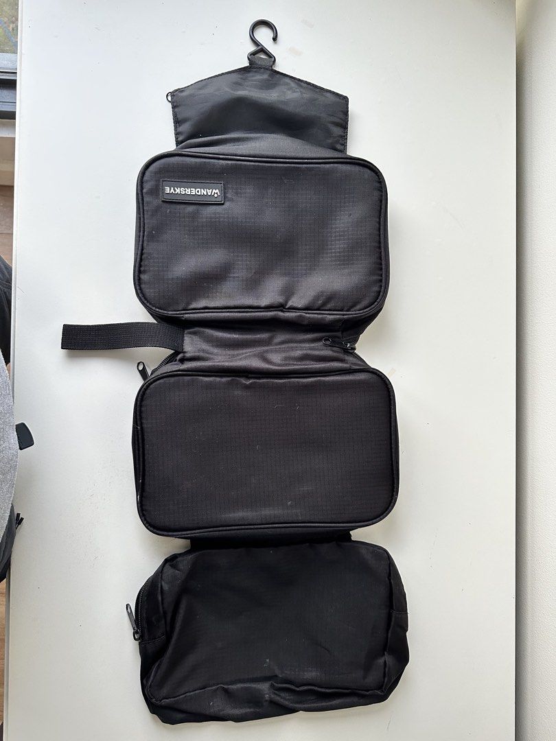 WANDERSKYE Hanging Toiletry Bag Organizer (Category: Luxury Bags & Wallets) located in Quezon City. Submitted by donsalta (Listing ID 1456884057, Image 3). Description: - Brand: WANDERSKYE - Color: Black - Has multiple compartments for organization - Has a convenient hanging hook - Ideal for travel - Folds up neatly for easy storage.