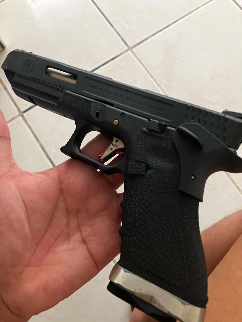 WE GBB Airsoft Pistol with Magazine (Category: Combat Sports) located in Manila. Submitted by jc_parker (Listing ID 1456883866, Image 2). Description: - WE G34 tmss GBB Pistol - Durable Metal Slide - Textured Grip for secure handling - Eye-catching Red Trigger - Comes with 1 Magazine - Ideal for Collection or Airsoft Play.