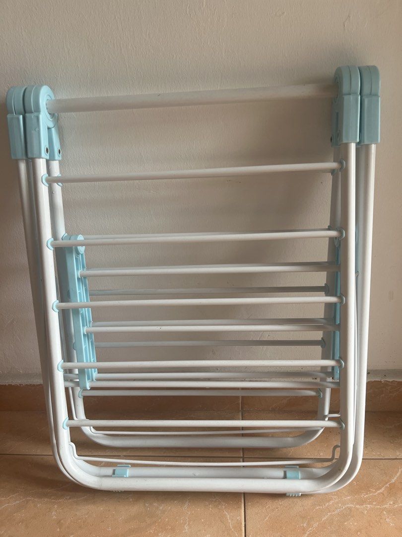 White Drying Rack only (Category: Shelves, Cabinets & Racks) located in Singapore. Submitted by premiumlian (Listing ID 1456815313, Image 2). Description: - Pink IKEA Kids Chair not selling only to compare - White Foldable Drying Rack: Great for laundry, space-saving for sales.