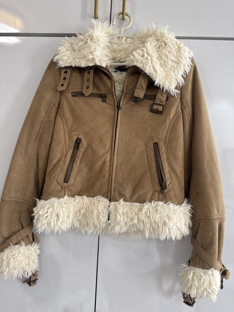 WInter FAux swede tan jacket (Category: Coats, Jackets and Outerwear) located in Quezon City. Submitted by TGDL123 (Listing ID 1456856787, Image 1). Description: Tan or camel color suede-look aviator jacket with plush ivor faux lining and trims. Statement buckles, zip pockets, adjustable cuff straps. 16x18x19” .