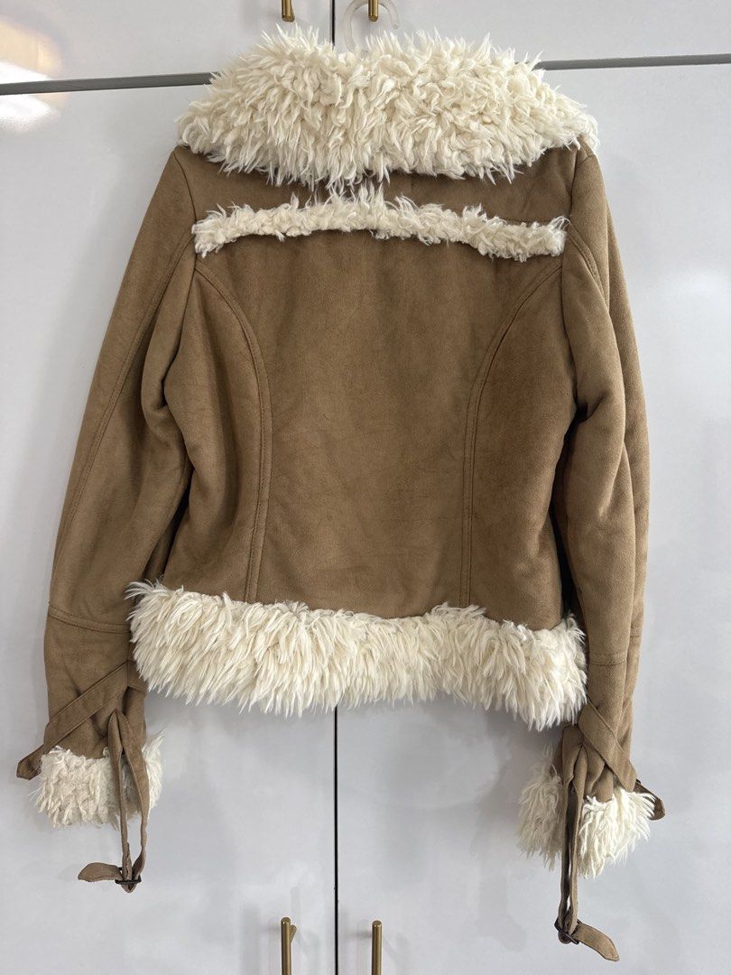 WInter FAux swede tan jacket (Category: Coats, Jackets and Outerwear) located in Quezon City. Submitted by TGDL123 (Listing ID 1456856787, Image 2). Description: Tan or camel color suede-look aviator jacket with plush ivor faux lining and trims. Statement buckles, zip pockets, adjustable cuff straps. 16x18x19” .