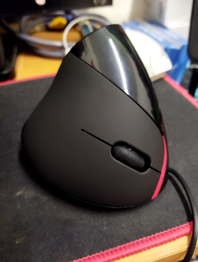 Wired Ergonomic Vertical Mouse - Black (Category: Mouse & Mousepads) located in Santa Rosa. Submitted by vanarkride29812 (Listing ID 1456789374, Image 2). Description: - Black ergonomic vertical mouse - Comfortable grip for long computer sessions - Scroll wheel and buttons fully functional - Wired connection - Helps reduce wrist strain - Tested and working perfectly.