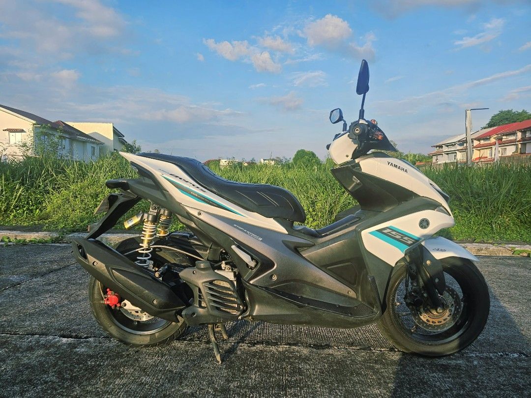 Yamaha Aerox 155 White 1st gen (Category: Motorbikes for Sale) located in Binan City. Submitted by Sunny_RJ (Listing ID 1456920201, Image 1). Description: Selling my beloved Yamaha Aerox 1st Gen White ABS. ◽ Condition: Registered, minor/minimal scratches due to usage, but absolutely zero performance issues. Alagang-alaga ang makina. ◽ Riding Feel: Balanced, fast, and incredibly safe with the dual disc brake configuration..