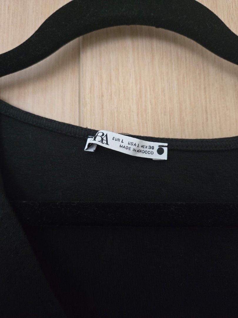 Zara Black Twisted Front Short Sleeve Top (Category: Blouses) located in Quezon City. Submitted by samcas (Listing ID 1456886314, Image 2). Description: Zara black top, size L. Features a unique twisted front detail and short sleeves. no issues.