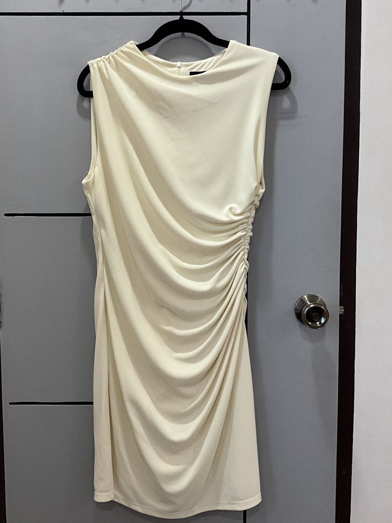 ZARA Ruched Midi Dress Cream (Category: Dresses) located in Manila. Submitted by shopmrld (Listing ID 1456936073, Image 2). Description: - ZARA cream midi dress - Size on tag : L - Runs small - Flattering ruched side detail - Zipper closure at the back - Used once only.