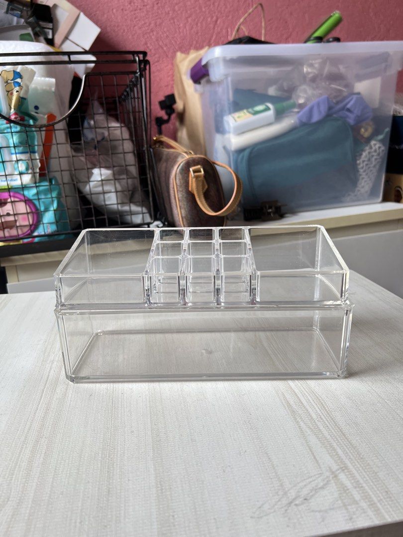2-Layer Clear Acrylic Makeup Organizer (Category: Makeup) located in Quezon City. Submitted by kaye_mm (Listing ID 1457034320, Image 2). Description: - Two-piece clear acrylic organizer - Top tray with multiple compartments for lipsticks & small items - Deep lower layer for larger products - Stackable design for space-saving - Keeps vanity/desk tidy and organized - Ideal for makeup, skincare, or desk essentials.