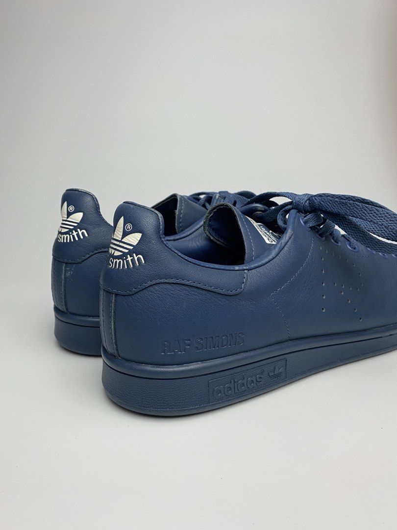 Adidas Raf Simons Stan Smith Navy Blue Leather Sneakers (Category: Sneakers) located in Lipa City. Submitted by 4217_ (Listing ID 1457010677, Image 3). Description: - Navy blue Adidas Stan Smith sneakers designed by Raf Simons - Premium leather construction - Classic silhouette with Raf Simons branding - Perforated Adidas logo detail - Lace-up closure - Ideal for casual wear.