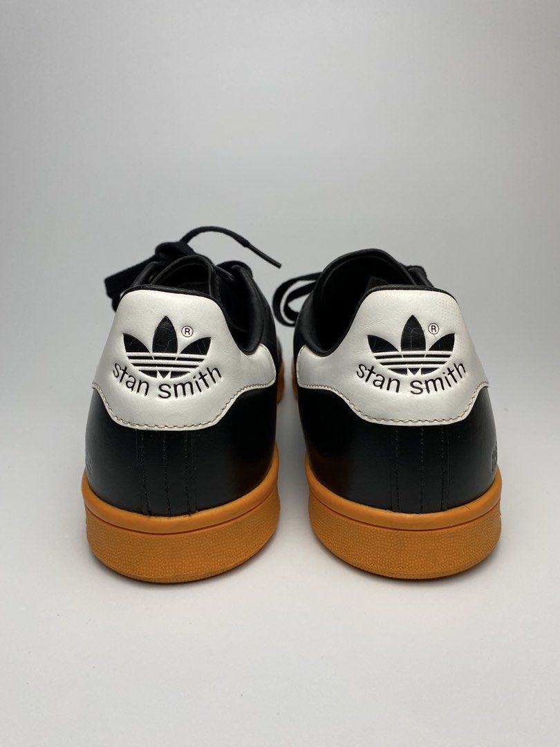 Adidas Stan Smith Raf Simons Black Gum Sole (Category: Sneakers) located in Lipa City. Submitted by 4217_ (Listing ID 1457010675, Image 3). Description: - Classic Adidas Stan Smith sneakers - Collaboration with Raf Simons - Black leather upper with white accents - Retro gum sole - Perforated side details - Perfect for casual wear - Shows some signs of wear on sole and leather.