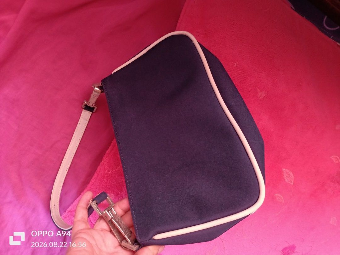 Agnès b. Navy Blue Shoulder Bag (Category: Luxury Bags & Wallets) located in Batangas. Submitted by ponylittle37795 (Listing ID 1457041661, Image 2). Description: - Navy blue shoulder bag by Agnès b. - Features a subtle light trim detail. - Adjustable strap with buckle for a customized fit. - Interior tag with 'Agnès b. Voyage' logo and globe graphics. - Ideal for everyday wear and versatile styling..