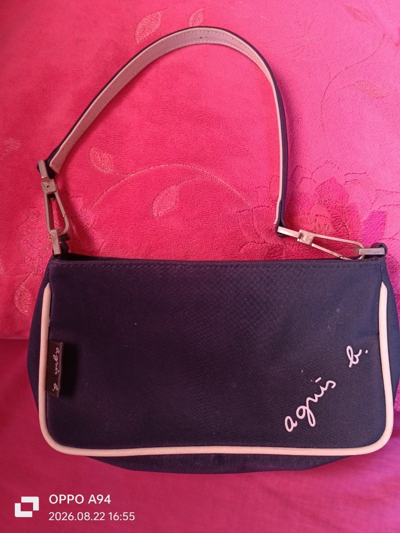 Agnès b. Navy Blue Shoulder Bag (Category: Luxury Bags & Wallets) located in Batangas. Submitted by ponylittle37795 (Listing ID 1457041661, Image 1). Description: - Navy blue shoulder bag by Agnès b. - Features a subtle light trim detail. - Adjustable strap with buckle for a customized fit. - Interior tag with 'Agnès b. Voyage' logo and globe graphics. - Ideal for everyday wear and versatile styling..