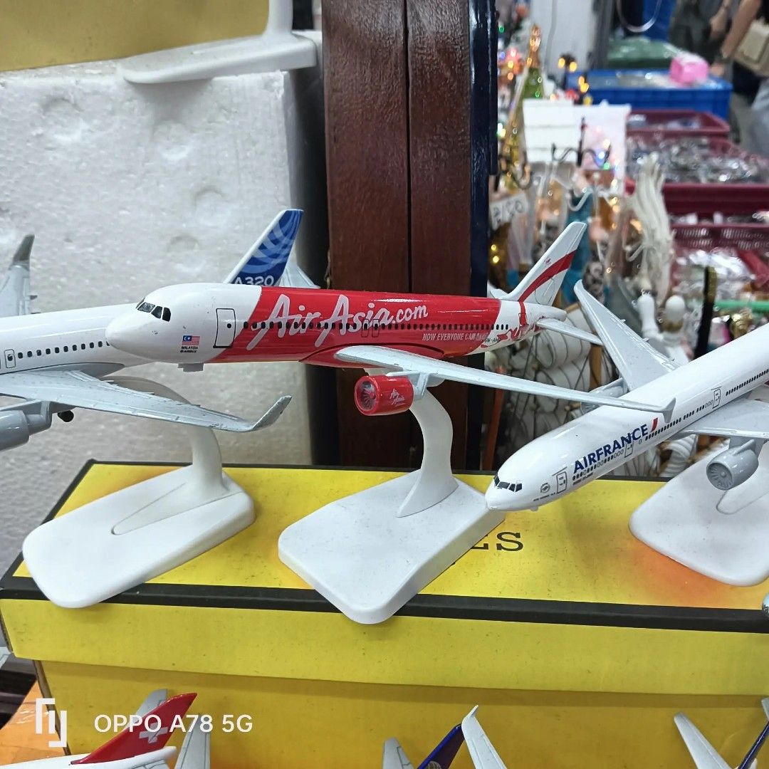 AirAsia Airplane Model with Stand (Category: Vehicle & Diecast Models) located in Manila. Submitted by hasylne.818 (Listing ID 1457027295, Image 1). Description: - Diecast AirAsia airplane model - Features the iconic red and white livery - Includes a display stand - Ideal for collectors or as a decorative piece - Looks great on any shelf - Check out our other available models!.