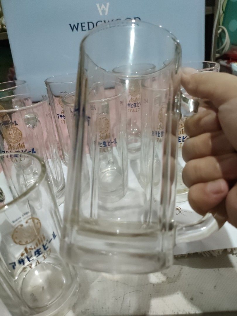 Asahi Beer Glass Mugs Set (Category: Other Kitchenware & Tableware) located in Bulacan. Submitted by hunterherojapanjdm (Listing ID 1457109251, Image 2). Description: - Set of 9 Asahi beer glass mugs - Features classic Asahi logo and Japanese text - Sturdy handles for a comfortable grip - Ideal for enjoying beer at home - Perfect for parties or personal use.