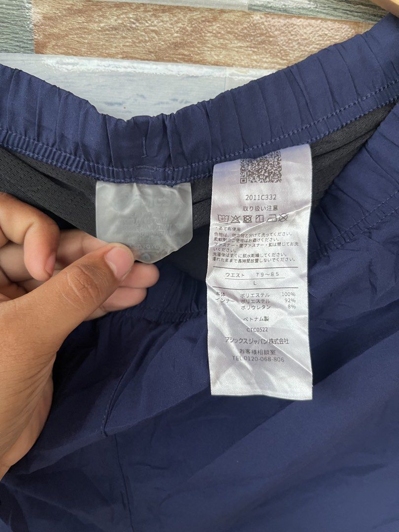 ASICS Navy Blue Running Shorts Men's Size L (Category: Activewear) located in Molave. Submitted by find_danz (Listing ID 1457090152, Image 3). Description: - ASICS Running Shorts - Color: Navy Blue - Size: L (Tag) - Features: Elastic waistband with drawstring - Material: Lightweight for comfort - Design: ASICS logo on front leg - Ideal for: Running, training, or casual wear.