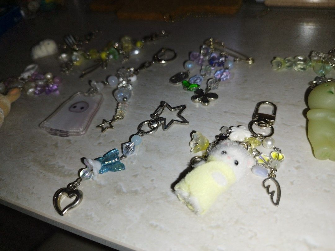Assorted bead keychains (Category: Character Goods) located in Singapore. Submitted by unicornfarts23 (Listing ID 1457045955, Image 2). Description: DM for condi! buy more for cheaper yellow beaded keychain ❌ blue beaded keychain $2 purple slyvanian keychain $9 ghost slyvanian acrylic keychain beaded $6 smiski beaded keychain $11 yellow mini slyvanian beaded keychain $12 purple pin beaded ❌ Take rest for $32!! .