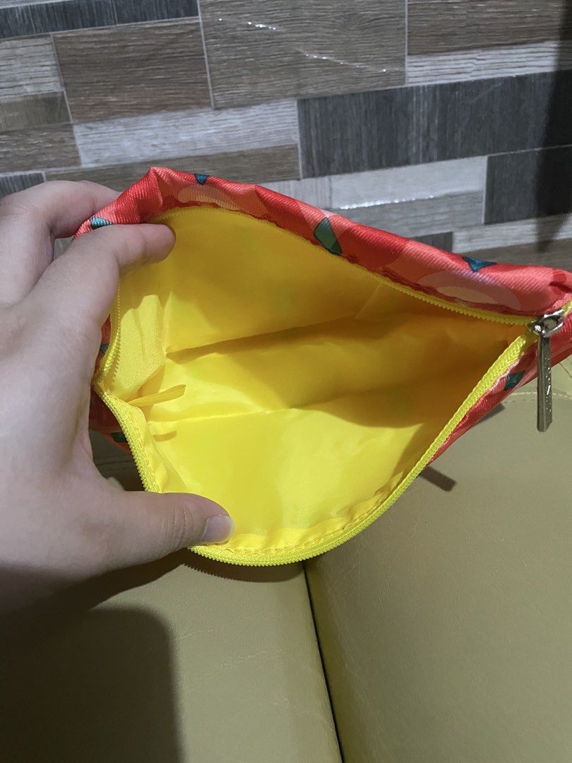 Authentic Clinique Red Geometric Makeup Bag (Category: Makeup) located in Manila. Submitted by prelovedpicksph (Listing ID 1457131364, Image 2). Description: — in good condition, no flaws .