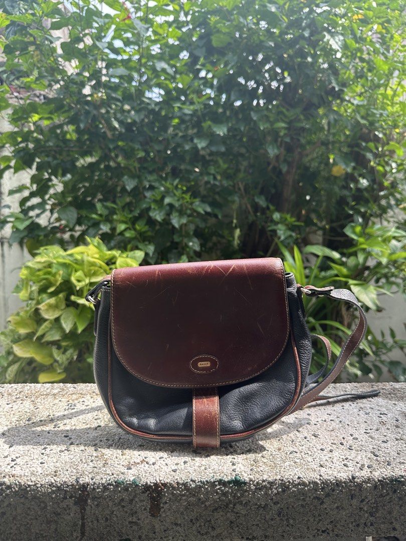 Bally Leather Shoulder Bag (Category: Luxury Bags & Wallets) located in Pasig City. Submitted by lancer501 (Listing ID 1456973987, Image 1). Description: - Vintage Bally shoulder bag - Classic two-tone design: brown and black leather - Adjustable shoulder strap - A timeless addition to any collection -shipping shouldered by buyer.