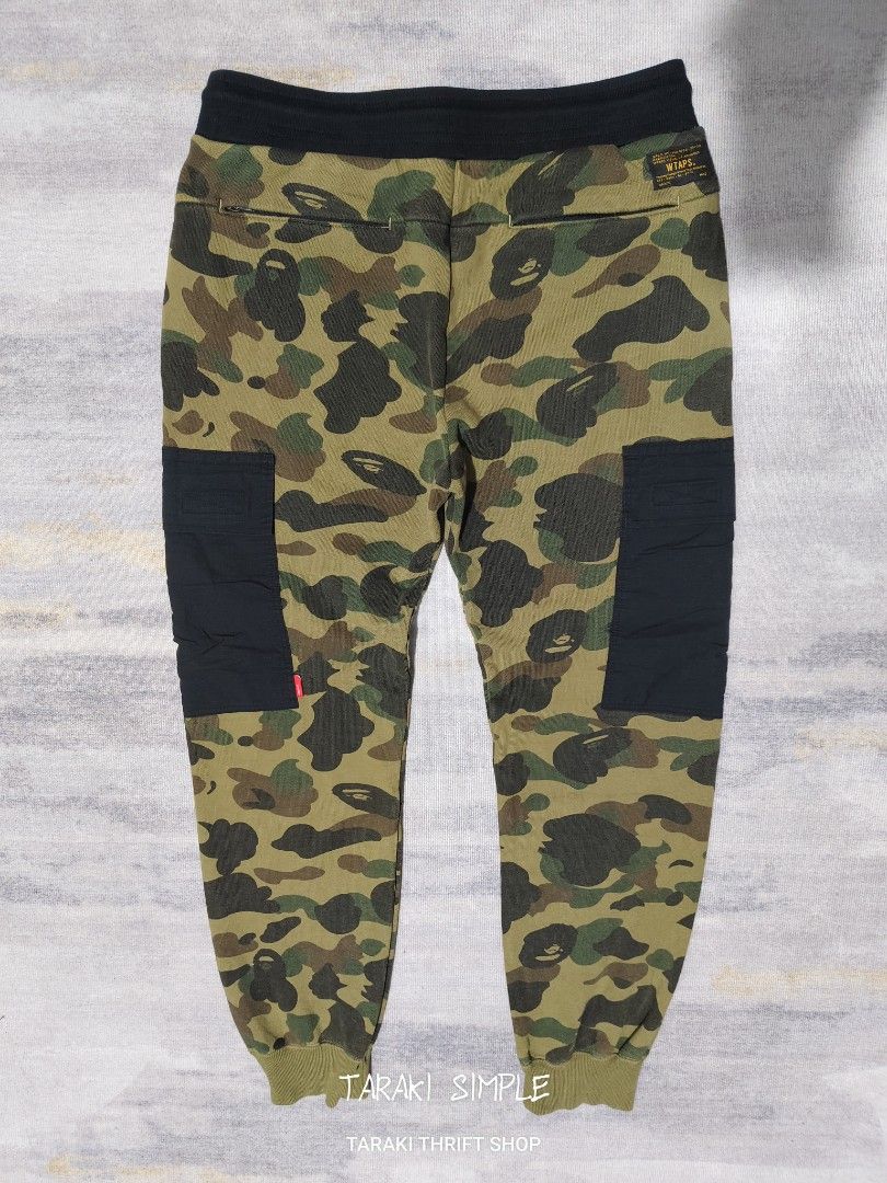BAPE X WTAPS CAMOU JOGGER PANTS (Category: Joggers) located in Baguio. Submitted by igorotak.111.taraki.com (Listing ID 1457101535, Image 2). Description: FS BAPE X WTAPS CAMOU JOGGER PANTS MADE IN JAPAN V.GOOD CONDI NO ISSUES SOLID NITO ♥️ L-38 W-31 STRETCH UP TO 33 CAN FIT 30-33 CAN DO WTH ADJUSTBLE TIE H-4.8.