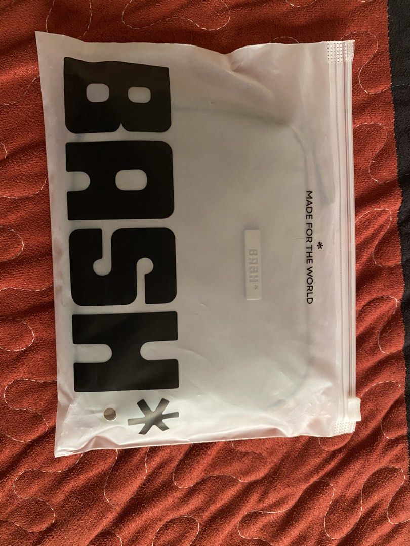 BASH Essential Passport - Oak (Category: Purses & Pouches) located in Manila. Submitted by ikesfrancia (Listing ID 1456996987, Image 2). Description: - Authentic BASH* pouch - Color: Neutral taupe - Features zipper closure - Comes with original tag - Includes clear BASH* bag - Ideal for organizing small items.