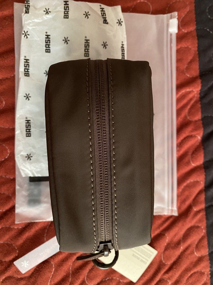 BASH Out of Office Purse - Terra (Category: Purses & Pouches) located in Manila. Submitted by ikesfrancia (Listing ID 1456996424, Image 2). Description: - Brand: BASH - Color: Brown - Includes original packaging and care guide - Features a zipper closure - Ideal for organizing small items - Perfect for travel or everyday use - Clean and simple design.