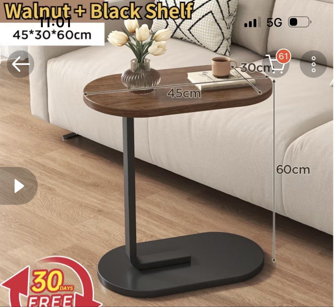 Side Table (Category: Tables & Sets) located in Singapore. Submitted by beigepoppies (Listing ID 1456974414, Image 2). Description: Side/bedside table that can be used for putting laptop, food etc near your sofas or beds Selling cause I don’t really use it - in good condition and selling for cheap Walnut + black coloured Measurements in pics Self collect around Bukit Panjang area or arrange your own delivery!.