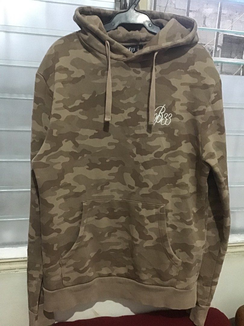 Bee Inspired Camo Hoodie Size L (Category: Coats, Jackets and Outerwear) located in Manila. Submitted by sandobag (Listing ID 1457054299, Image 1). Description: - W 21.5 L 29 Good condition Color rate:9.8/10 Issue nasa pic. - Bee Inspired Brown Camouflage Hoodie - Size: Large (L) - Material: 65% Cotton, 35% Polyester - Features: Front pocket, hood - Condition: Small tear near pocket area (refer to last photo for detail).