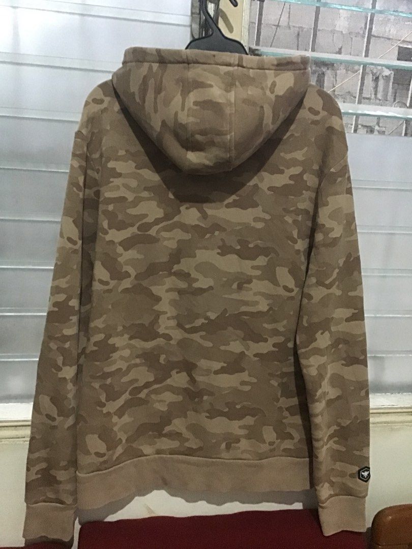 Bee Inspired Camo Hoodie Size L (Category: Coats, Jackets and Outerwear) located in Manila. Submitted by sandobag (Listing ID 1457054299, Image 2). Description: - W 21.5 L 29 Good condition Color rate:9.8/10 Issue nasa pic. - Bee Inspired Brown Camouflage Hoodie - Size: Large (L) - Material: 65% Cotton, 35% Polyester - Features: Front pocket, hood - Condition: Small tear near pocket area (refer to last photo for detail).