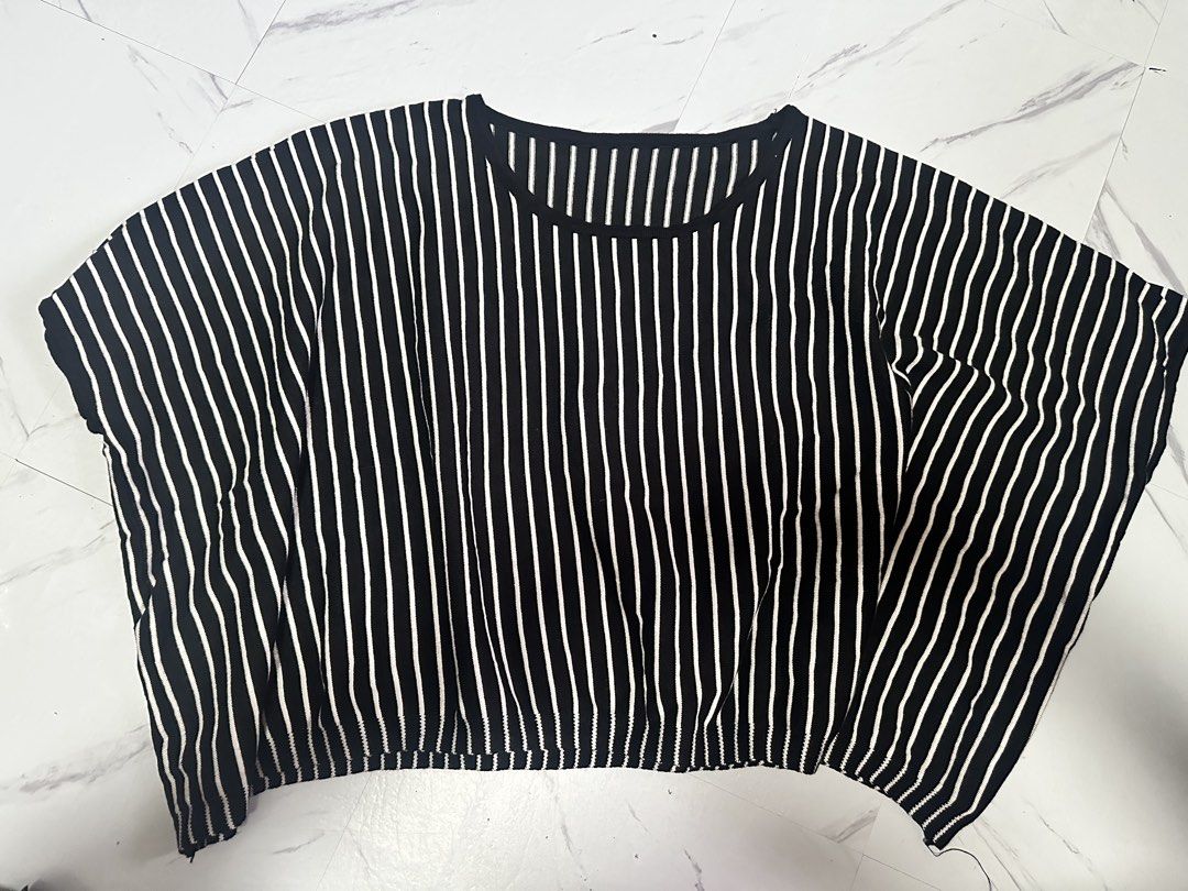 Black and White vertical Striped Loose Fit Top (Category: Blouses) located in Manila. Submitted by tipidfinds888 (Listing ID 1457089413, Image 1). Description: - Black top with white vertical stripes - Loose, flowy fit - Short sleeves - Round neckline - Ideal for casual wear - Easily pairs with jeans or shorts.
