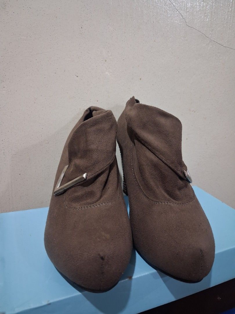 Brown suede ankle boots with rhinestone heels (Category: Boots) located in Quezon City. Submitted by cutesypatootie (Listing ID 1456963205, Image 3). Description: - Original price: 999 - Material: Faux suede - Size: 6 - Brand: nxy - Flaws: Some studs are missing & dark, needs cleaning, sole of the left pair is missing - Matigas sa bandang part ng toes - Masikip sa paa kung mataba paa mo - RFS: Decluttering ♡ No asking of additional photos ♡ Pleas