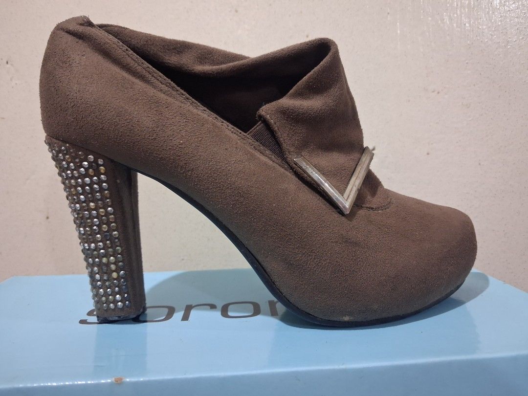 Brown suede ankle boots with rhinestone heels (Category: Boots) located in Quezon City. Submitted by cutesypatootie (Listing ID 1456963205, Image 2). Description: - Original price: 999 - Material: Faux suede - Size: 6 - Brand: nxy - Flaws: Some studs are missing & dark, needs cleaning, sole of the left pair is missing - Matigas sa bandang part ng toes - Masikip sa paa kung mataba paa mo - RFS: Decluttering ♡ No asking of additional photos ♡ Pleas