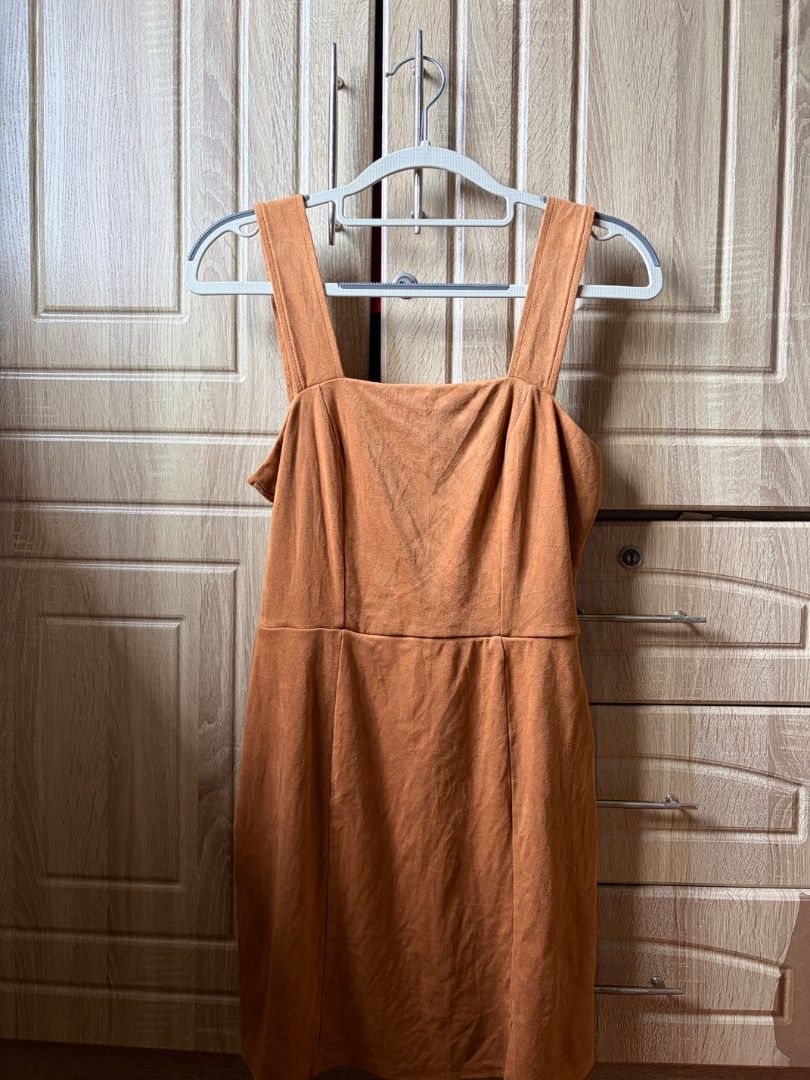 Brown Suede Square Neck Mini Dress (Category: Dresses) located in Tanza. Submitted by kmoarse (Listing ID 1457081359, Image 1). Description: - Adorable brown suede mini dress - Chic square neckline with thick straps - Convenient back zipper closure - Flattering fitted waist with a gentle flare - Versatile for night outs or casual wear - Used once.