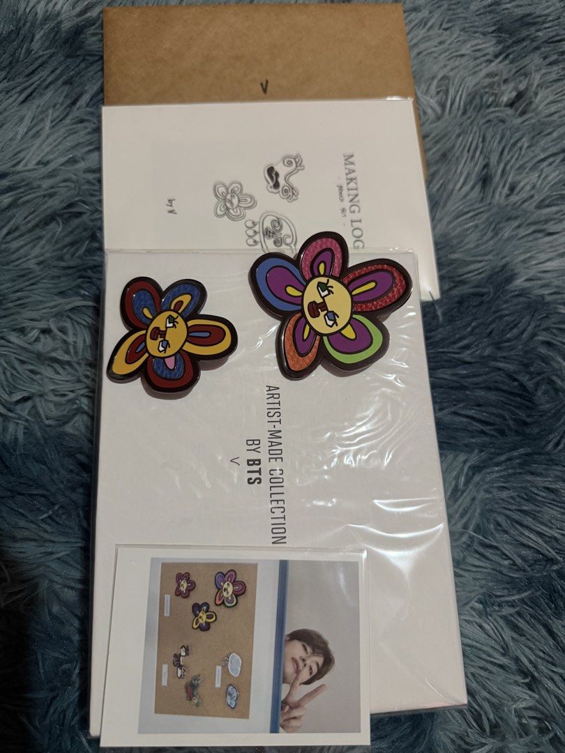 BTS Artist Made Collection V Brooch set (Category: Brooches) located in Manila. Submitted by assortedmixies (Listing ID 1456982807, Image 3). Description: - Authentic BTS Artist Made Collection brooch set by V. - Features V's unique and colorful flower design. originally 3 brooches, but im keeping the smallest one. - Perfect for accessorizing bags, clothes, and more. - Comes with a special photo card. - Meetup available at Robinsons Magnolia, Que