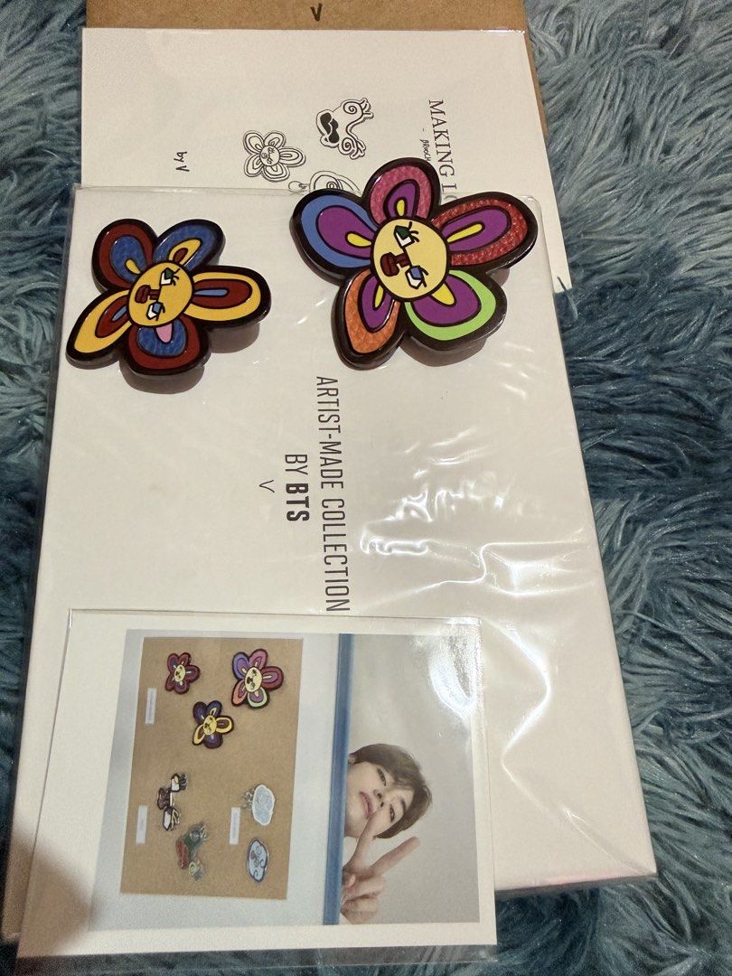 BTS Artist Made Collection V Brooch set (Category: Brooches) located in Manila. Submitted by assortedmixies (Listing ID 1456982807, Image 1). Description: - Authentic BTS Artist Made Collection brooch set by V. - Features V's unique and colorful flower design. originally 3 brooches, but im keeping the smallest one. - Perfect for accessorizing bags, clothes, and more. - Comes with a special photo card. - Meetup available at Robinsons Magnolia, Que